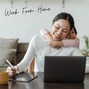Lady working from home on her laptop with kids around her