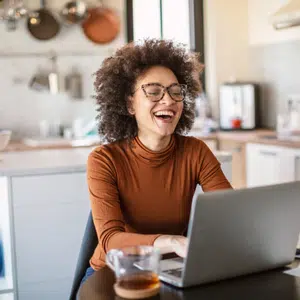 Lady at her table working from home when she became an avon rep