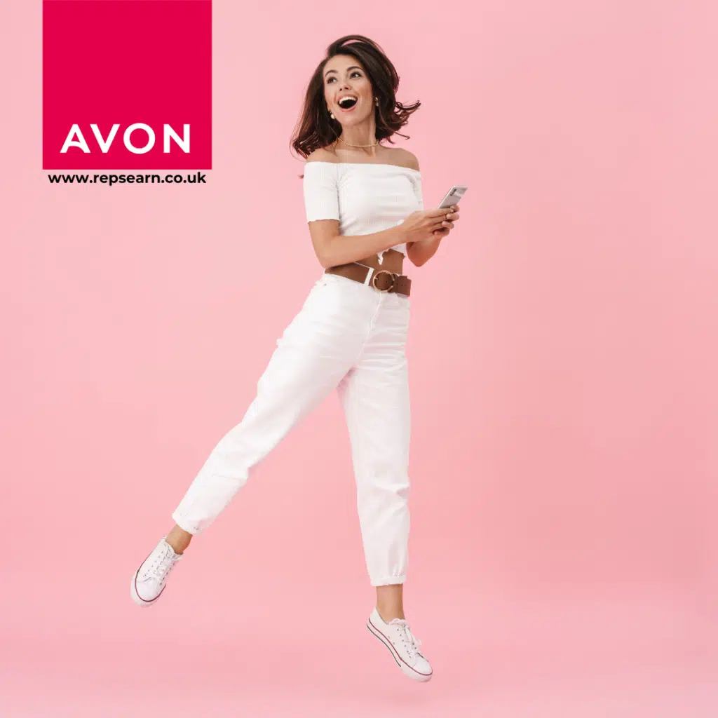 Lady holding her phone jumping, happy with the avon and reps earn logo